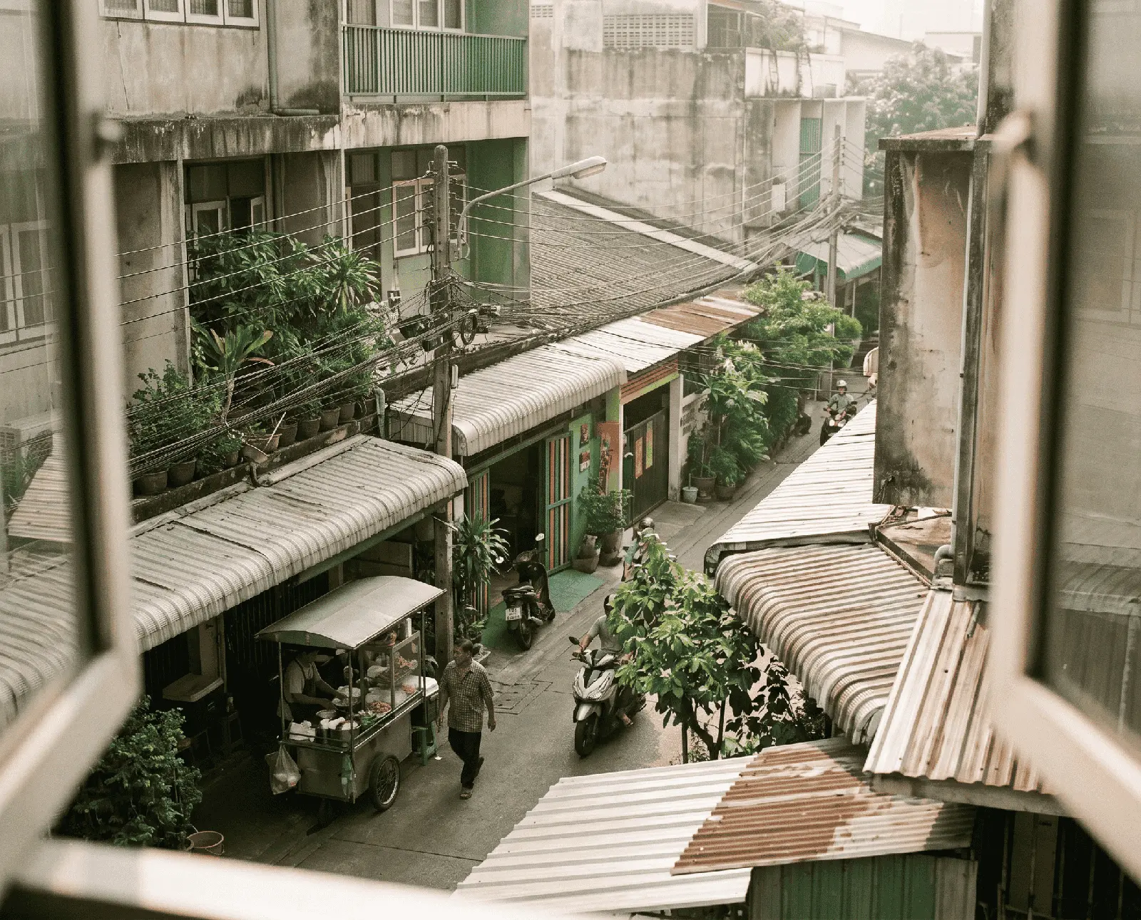 View across Yaba rooftops from a high window, Lagos, morning light